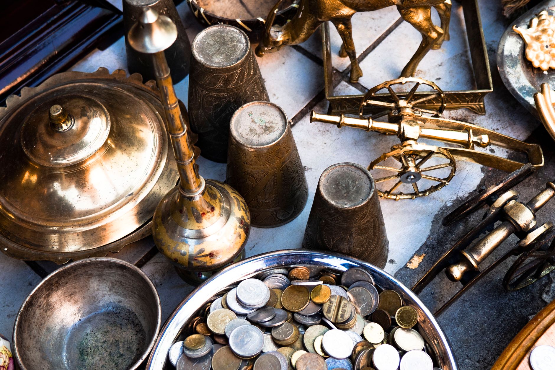 Corroded ancient bronze coins piled together after being excavated from soil